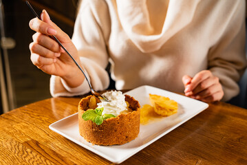 woman eating dessert with pineapple