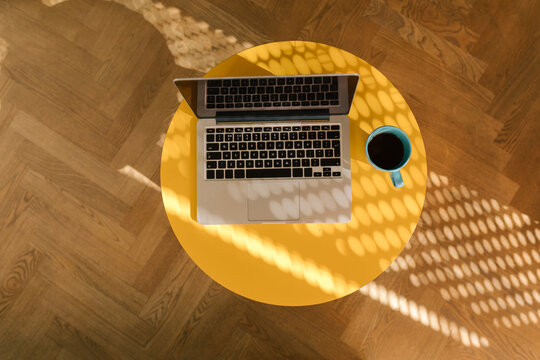 Laptop on a wooden table