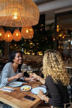 Multiethnic couple having dinner into restaurant