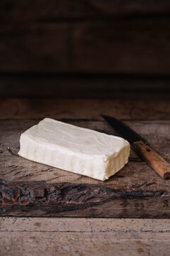 Piece of fresh homemade butter and knife