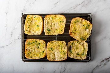 Homemade fresh slices of garlic bread