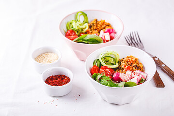 Fresh salad with couscous, tomatoes, cucumber, radish and chard.