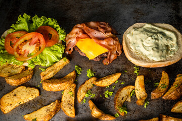 Burger ingredients isolated on rustic background.