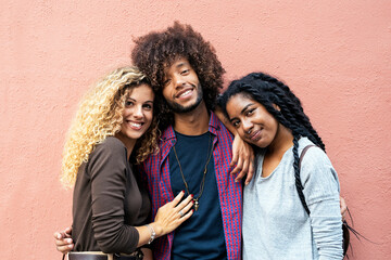 Group of happy friends having fun in the street. Friendship concept