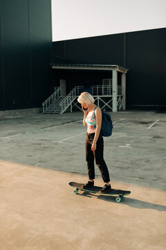 Real Woman With Longboard Outdoors