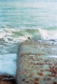 Pebbles hopping on a shore groyne