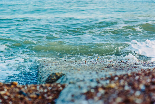 Pebbles hopping on a shore groyne