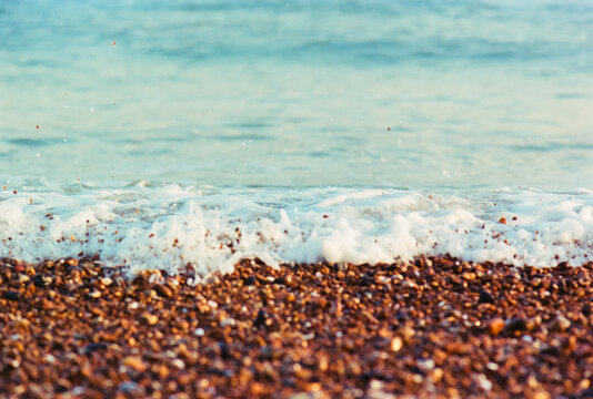 Pebbles hopping from the undertow