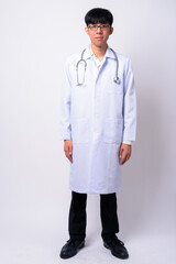 Portrait of young handsome Asian man doctor