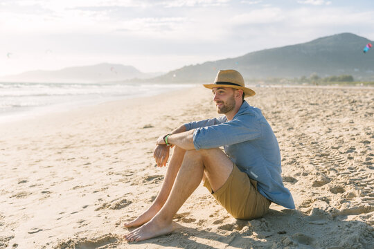 Young man enjoying at the beach