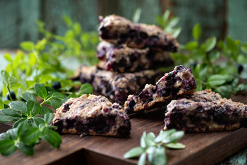 Blueberry scones on oak cutboard with blueberry leaves