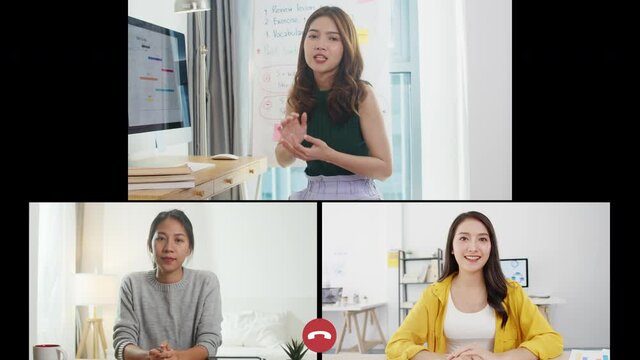 Asia businesswomen user interface of business team talk by video call share ideas brainstorming online meeting while use laptop work remotely from home. Social distancing, quarantine for corona virus