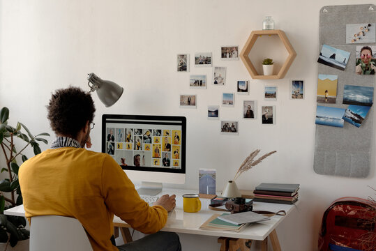 Unrecognisable Young Man Using Internet