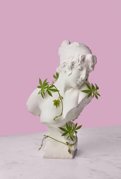 Goddess bust with cannabis leaves.