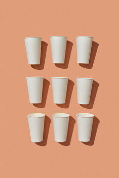 White paper cups with shadows.