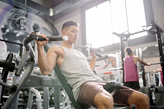 Asian man training in the gym