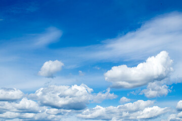 Naklejka na ściany i meble Cumulus clouds against a blue sky.