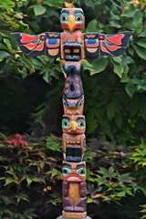 Closeup of large hand carved souvenir totem pole, Pacific Northwest, US and Canada 