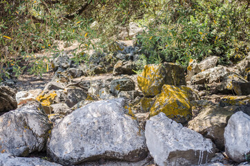 Rocks of volcanic origin on the beach of the island of Lihada-Greece 