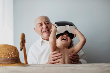 2 year old boy wearing VR glasses