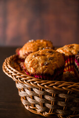 Homemade muffins on a wooden cutting board. Traditional festive Christmas baking.