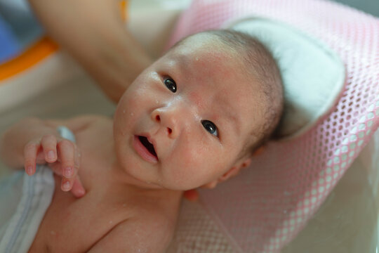 Close up of lovely newborn asian baby