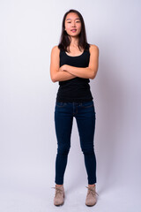 Portrait of happy young beautiful Asian woman