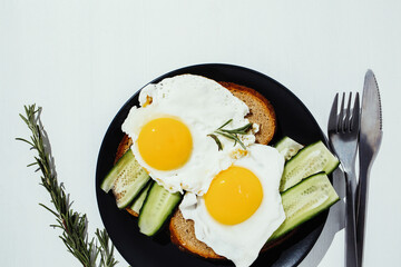 Fried eggs on the plate, healthy breakfast and proper nutrition