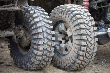 Fototapeta na wymiar Muddy off road tires on 4x4 cars