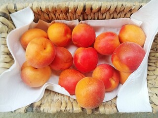 ripe apricots in a basket, close up