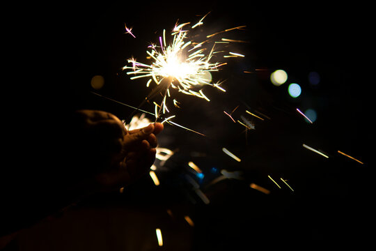 Sparklers burning at night in new year