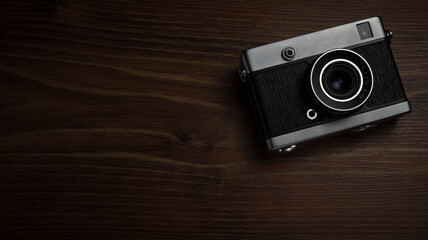 vintage compact camera on wood surface