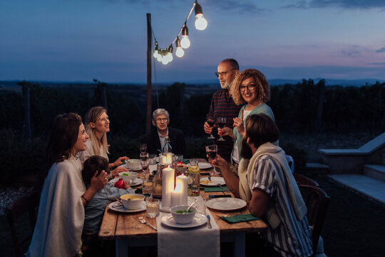 Middle-Aged Couple Toasting In The Backyard - Powered by Adobe