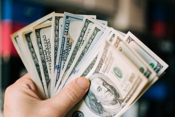 Close Up Of hands with one Hundred Dollar Bills