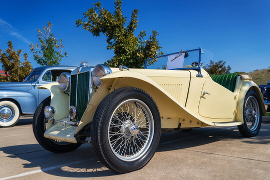 Front Side View Of A Yellow, Vintage 1947 MG TC Roadster Classic Car In Westlake, Texas.