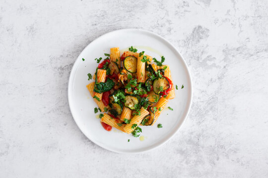 Maccheroni with cherry tomato, zucchini and parsley