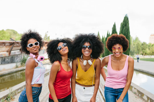Afro women friends hanging out in the city