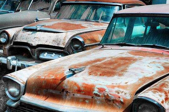 Rusted American Vintage Cars in Junkyard.