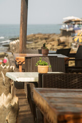 the tables in the waterfront cafes