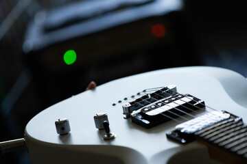 Close up of an electric guitar with bokeh