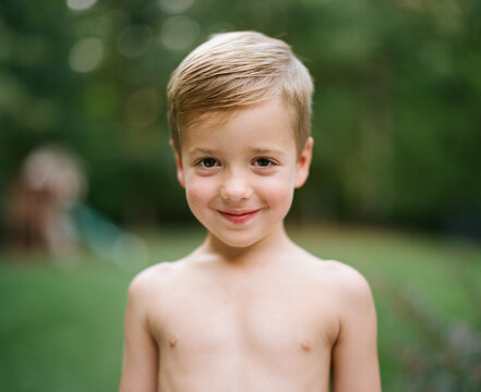 Naklejki Portrait of a cute young boy without a shirt