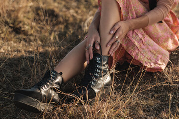 Close Up Of Woman Wearing Black Leather Boots Outdoors