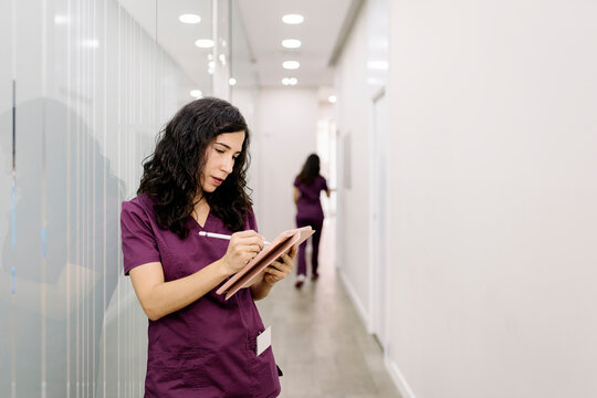 Doctor checking his phone while working in a hospital