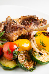 Modern French cuisine: Roasted Lamb neck & rack served with carrot, yellow curry and lamb sauce.