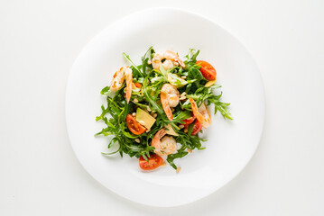 salad with shrimps, rocket salad and cherry tomatoes