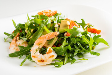 salad with shrimps, rocket salad and cherry tomatoes