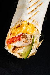 fajita wrap sandwich on the black background