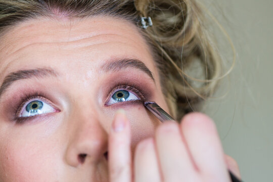 make up artist applying make up