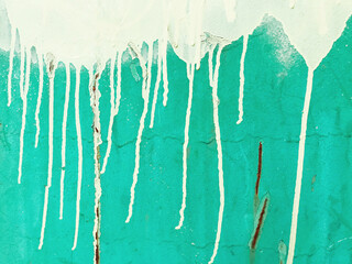 Close up of dripping graffiti paint on metal surface