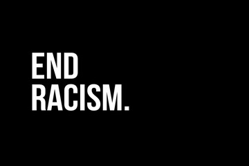 End Racism. White text on black background representing the need to stop racism